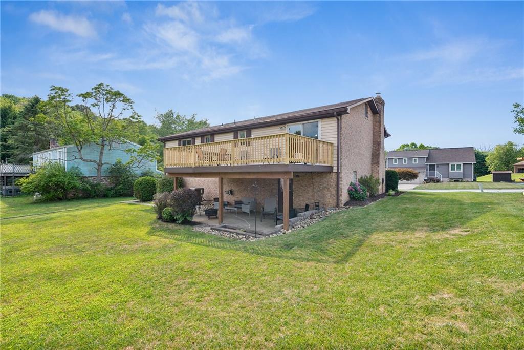 101 Edith Drive Hunker, PA 15639 - Photo 26 of 35 a view of a house with a yard and sitting area