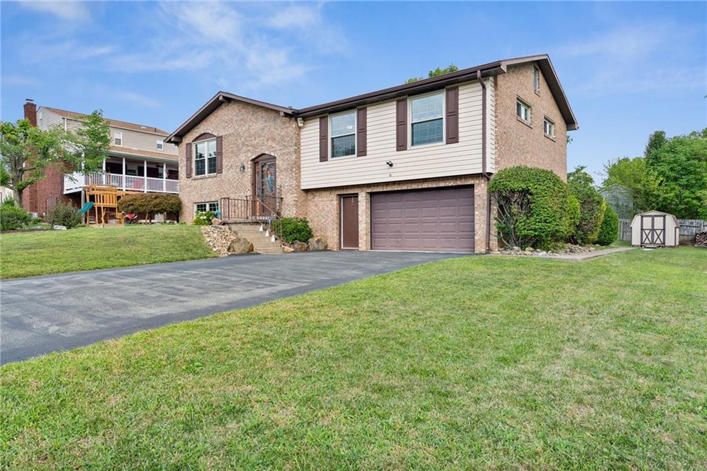 101 Edith Drive Hunker, PA 15639 - Photo 3 of 35 a front view of a house with garden