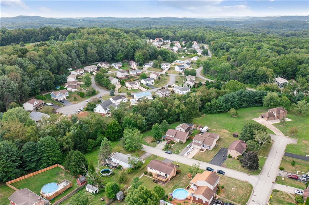 101 Edith Drive Hunker, PA 15639 - Photo 34 of 35 an aerial view of a house with a yard basket ball court and outdoor seating