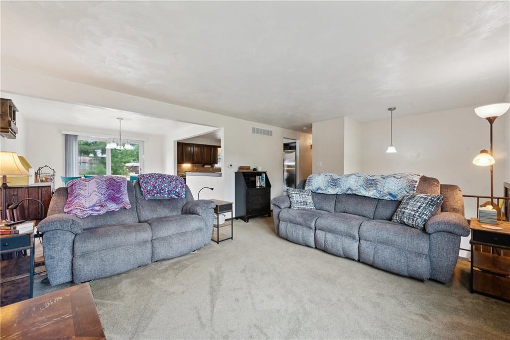 101 Edith Drive Hunker, PA 15639 - Photo 6 of 35 a living room with furniture and a couch