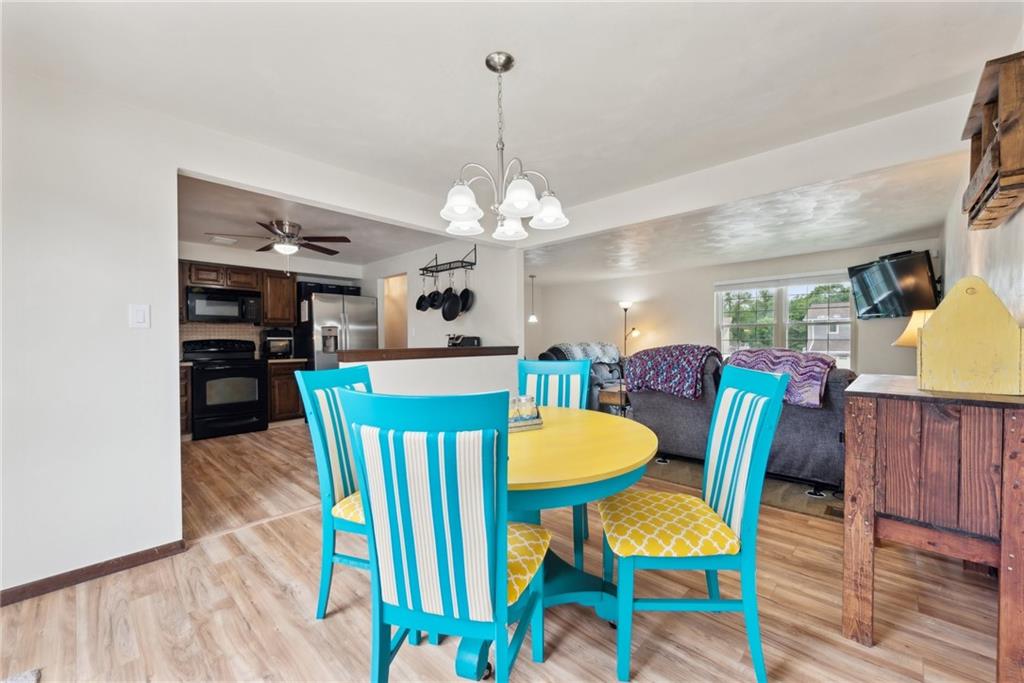 101 Edith Drive Hunker, PA 15639 - Photo 8 of 35 a view of a dining room with furniture and wooden floor