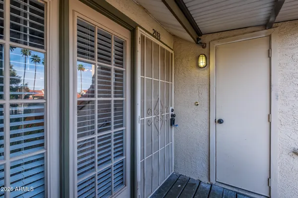a view of a street with cars parked