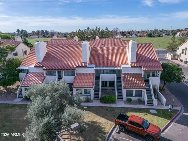 an aerial view of residential houses with outdoor space