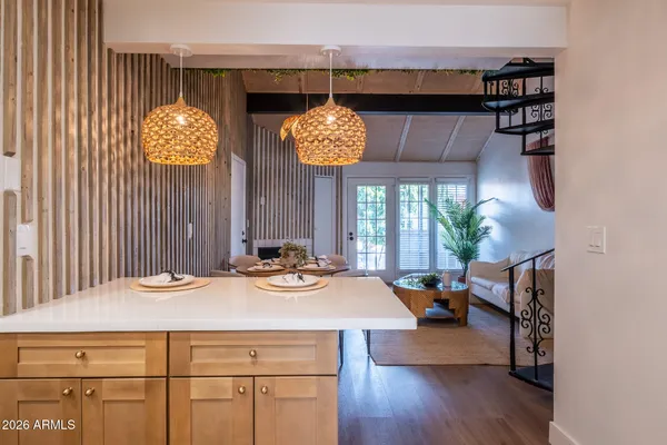 a view of a dining room with furniture and chandelier