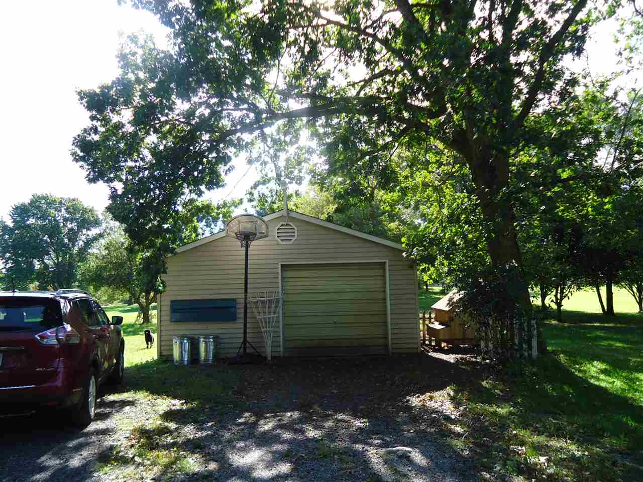 136 Tinkling Spring Road Fishersville, VA 22939 - Photo 8 of 24 a front view of a house with a yard and garage