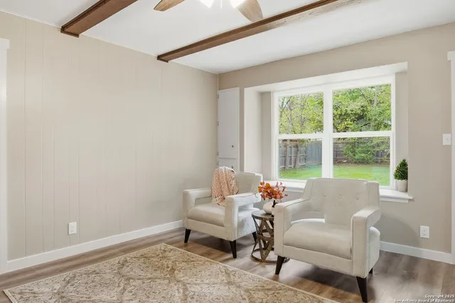 a living room with furniture and a window