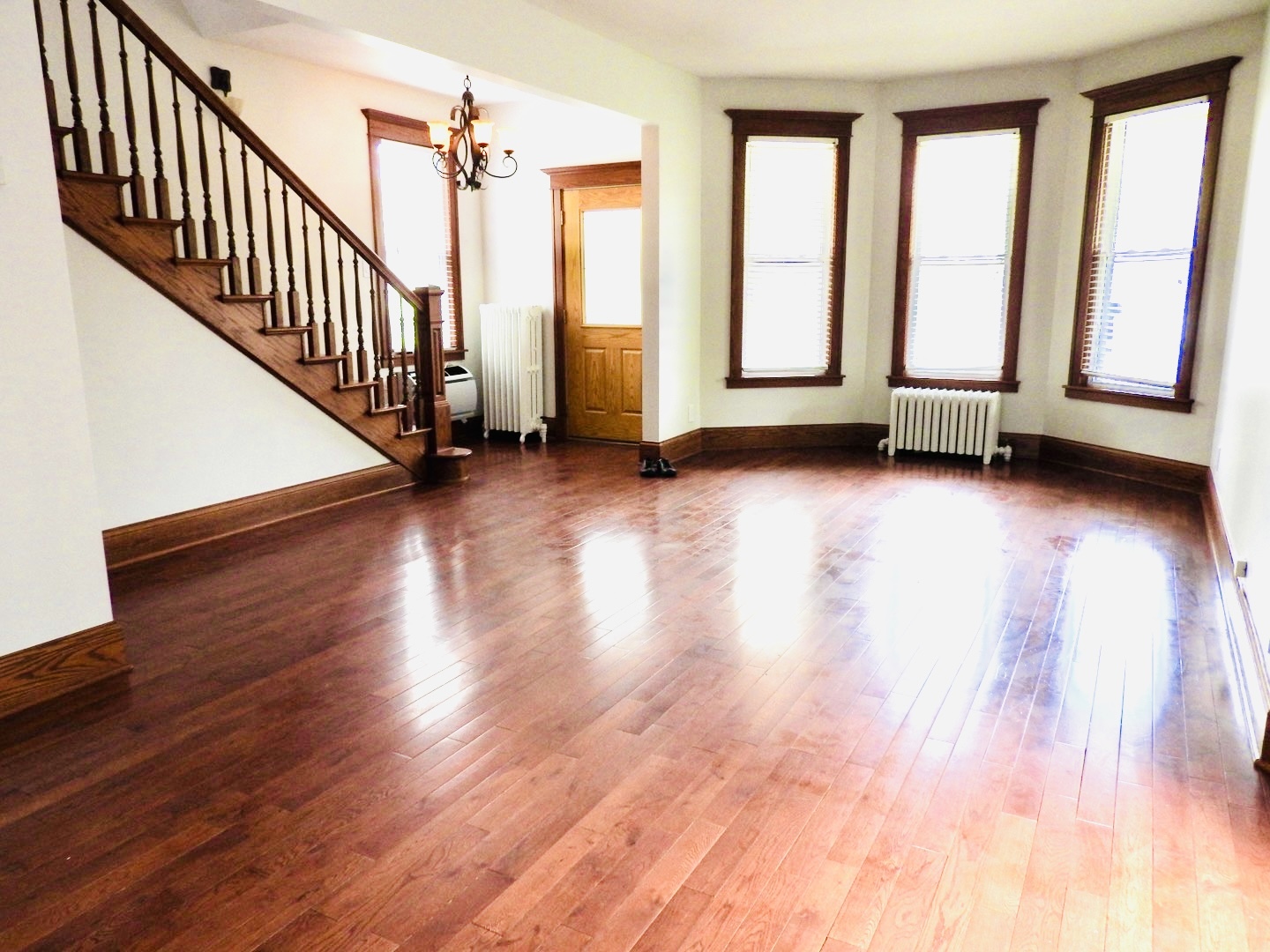 68 Kimbark Road Riverside, IL 60546 - Photo 8 of 13 a view of an empty room with wooden floor and a window