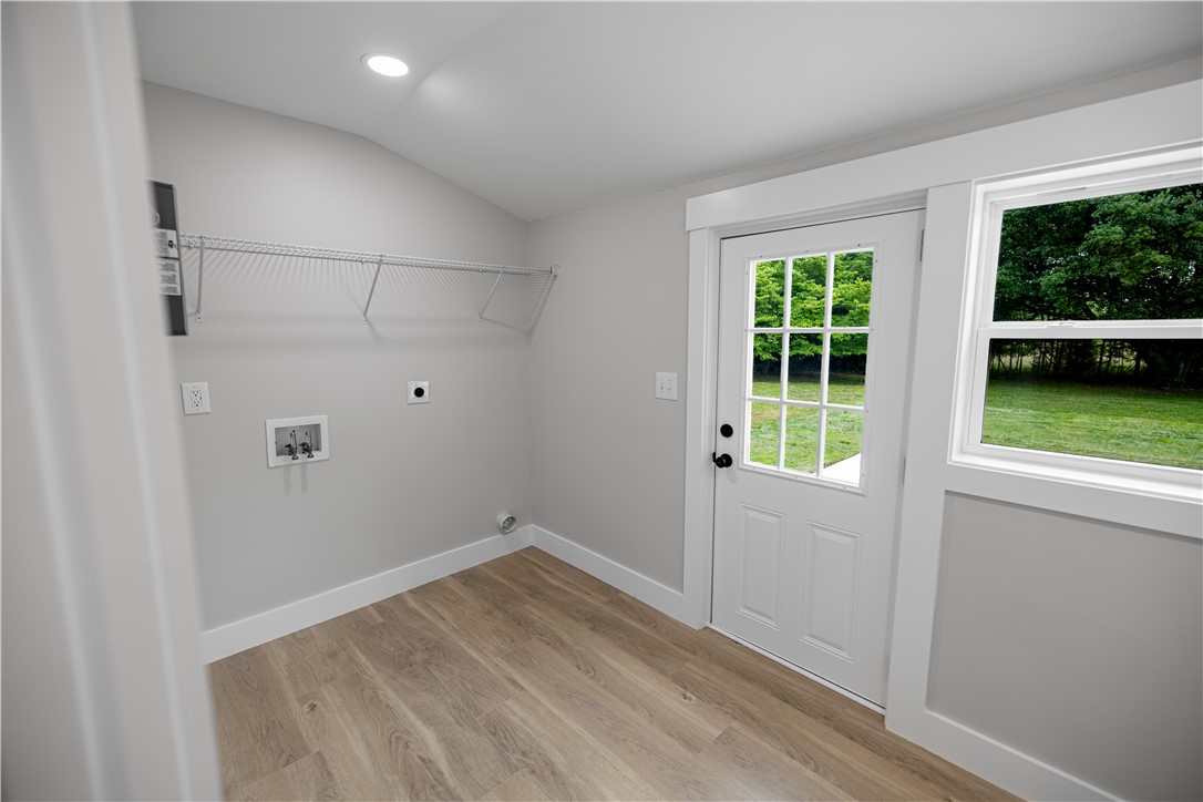 2817 Broadway Lake Road Anderson, SC 29621 - Photo 21 of 41 A dedicated laundry space with convenient outdoor access and practical storage shelving.