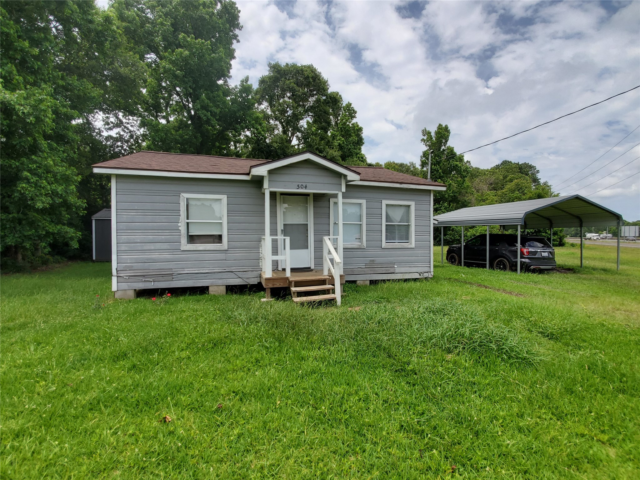 504 Pate Street Cleveland, TX 77328 - Photo 1 of 19 a view of a house with a backyard
