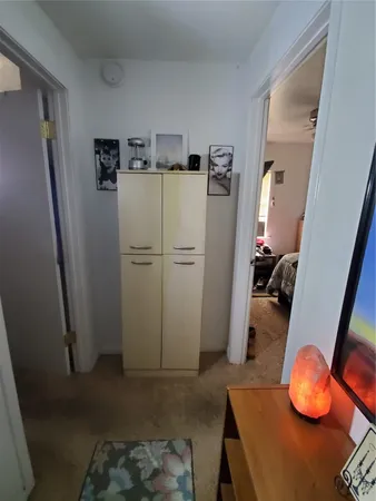 a bedroom with double bed and a microwave