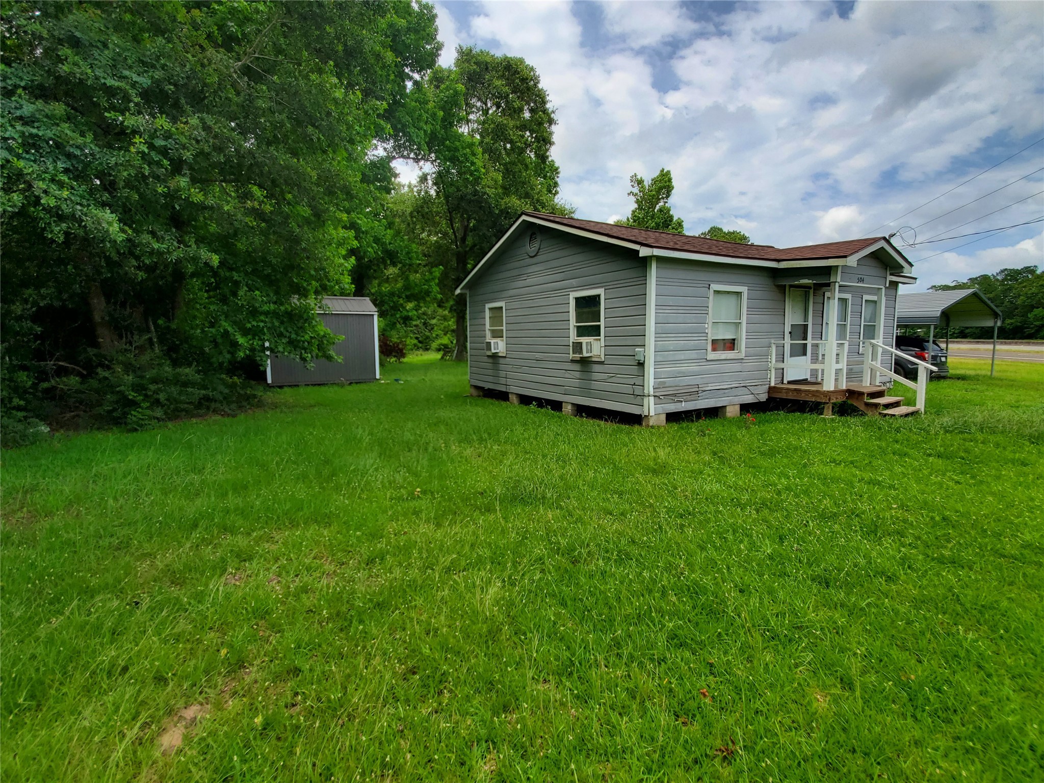 504 Pate Street Cleveland, TX 77328 - Photo 2 of 19 a view of a house with a yard