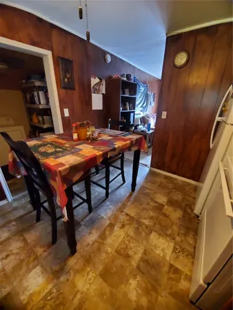 a room with table tennis pool table and chairs