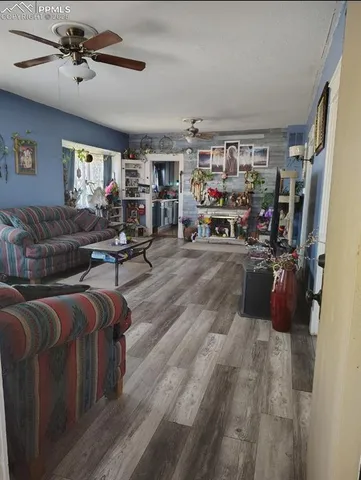 a living room with lots of furniture and a flat screen tv