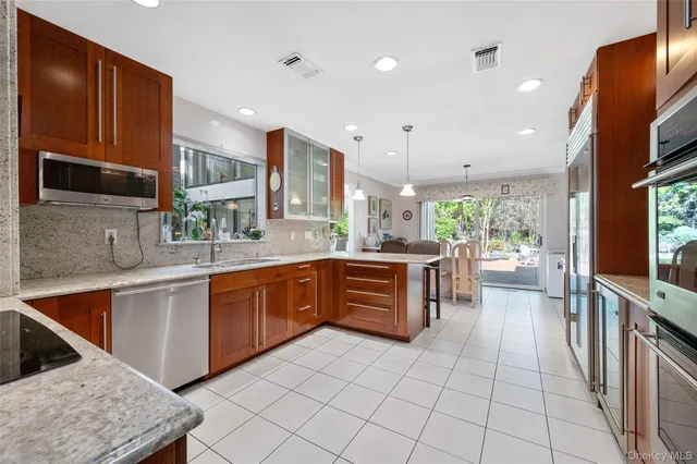 a bathroom with a sink a mirror and a toilet