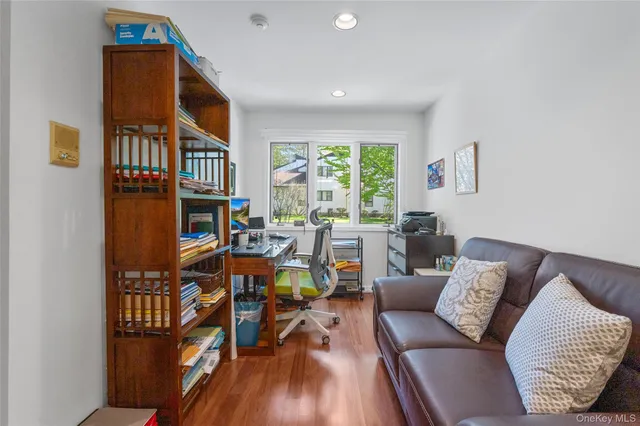a large white kitchen with a large window