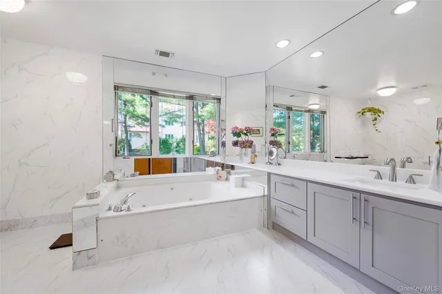 a view of a room with gym equipment and a large window