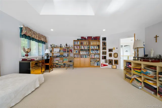 a bathroom with a granite countertop sink a toilet and shower