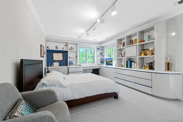 a bedroom with a bed and a couch