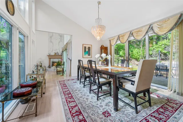 a large kitchen with stainless steel appliances lots of counter space and windows