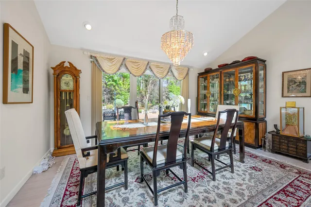 a kitchen with stainless steel appliances granite countertop a sink and wooden cabinets
