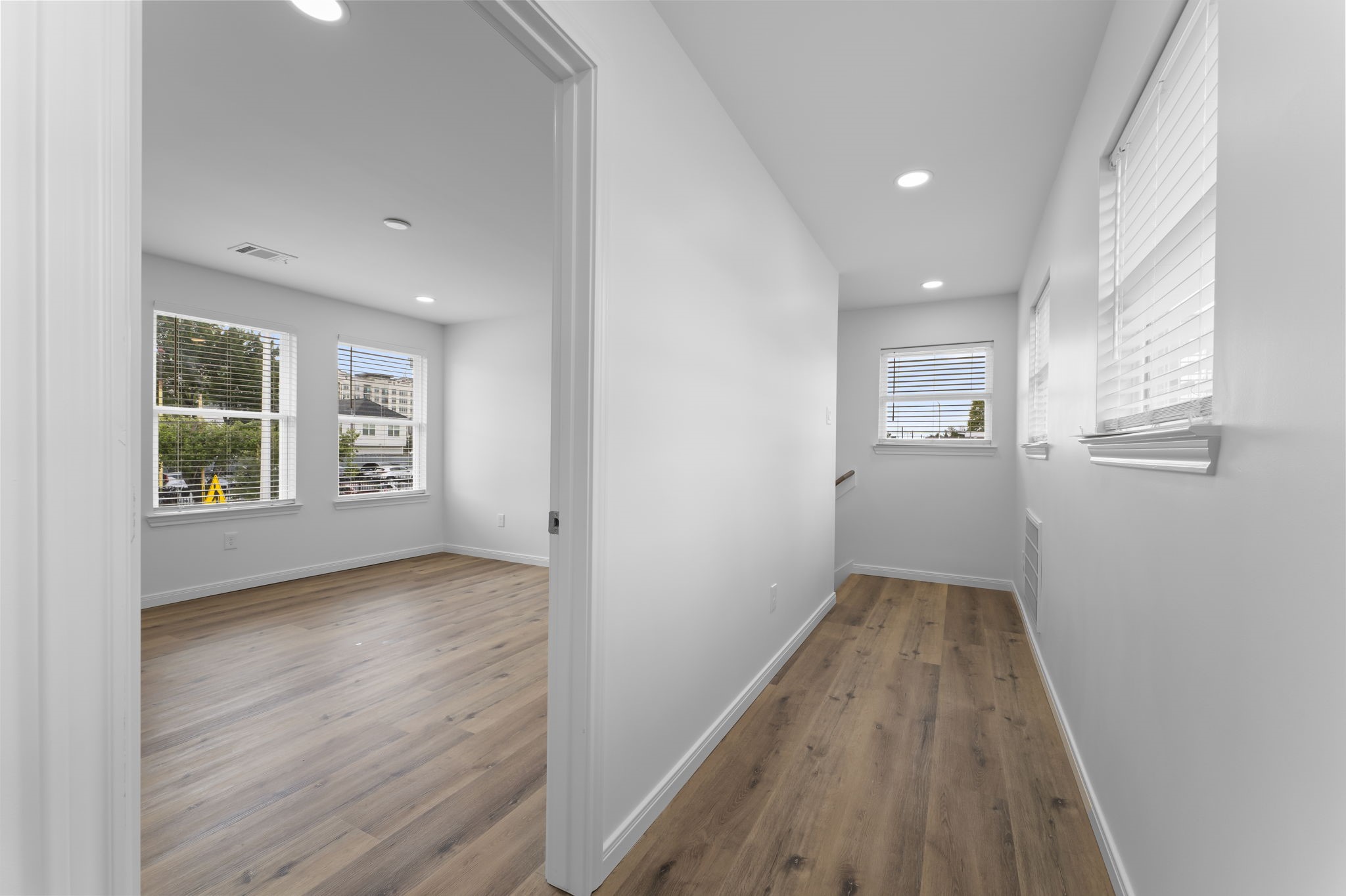 1507 North Durham Drive Houston, TX 77008 - Photo 23 of 35 wooden floor in an empty room with a window
