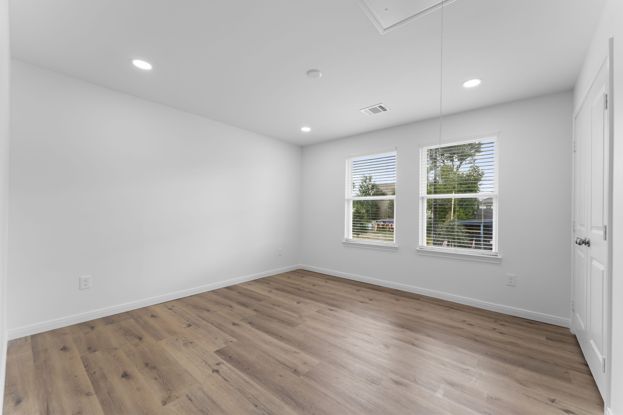 1507 North Durham Drive Houston, TX 77008 - Photo 27 of 35 an empty room with wooden floor and windows