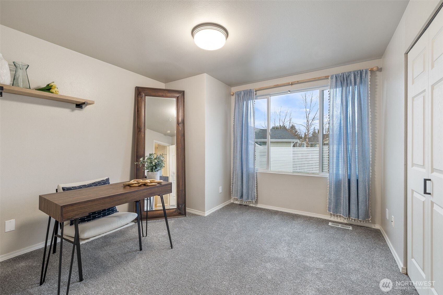 11895 Northeast 163rd Place, Unit 203 Bothell, WA 98011 - Photo 14 of 32 a room with furniture and a window