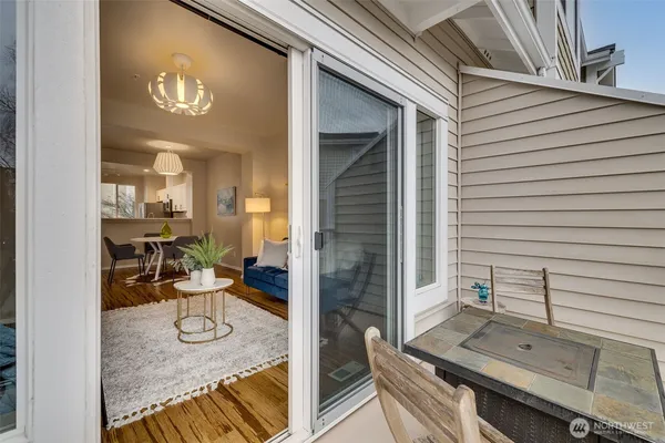 a view of a dinning room with furniture and floor to ceiling window