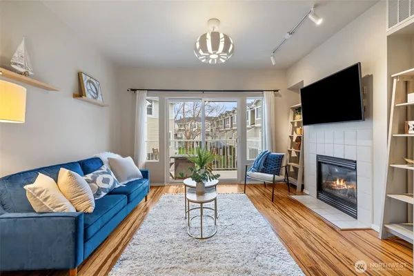 a living room with furniture fireplace and a flat screen tv
