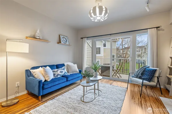 a living room with furniture and a large window