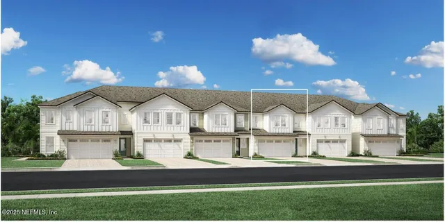 a view of a big house with a big yard and large trees