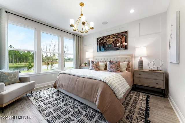 a bed room with furniture and a chandelier