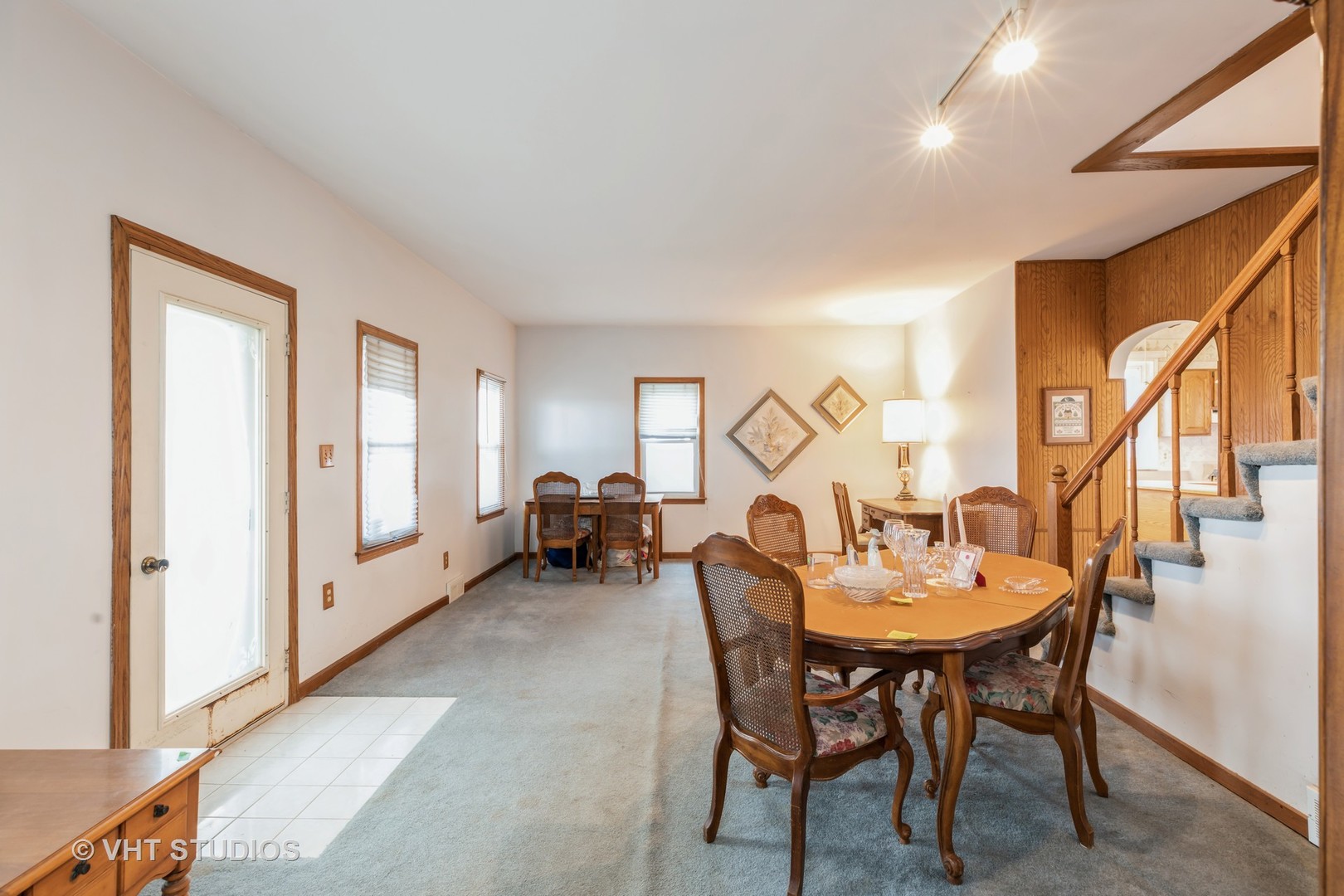 24960 South Scheer Road Monee, IL 60449 - Photo 7 of 26 a living room with furniture a large window and a chandelier