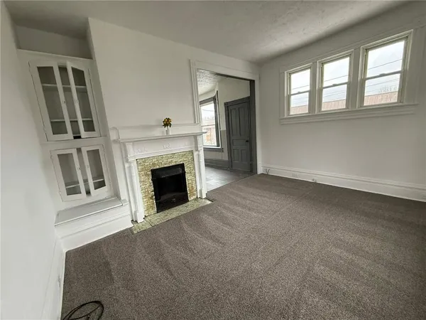 a kitchen with granite countertop a sink and wooden floor