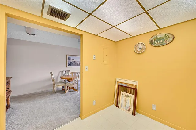 a kitchen with a refrigerator sink stove and cabinets