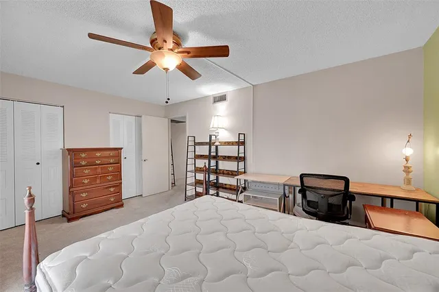 a bathroom with a sink a mirror and a shower