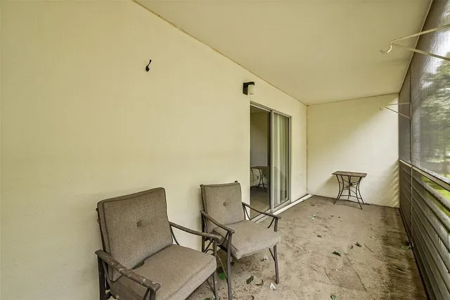 a view of a green field with wooden fence