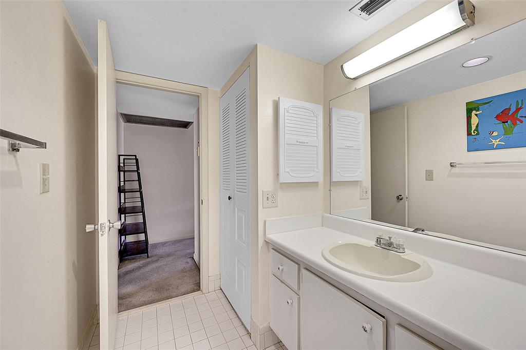 1901 Bermuda Circle, Unit F2 Coconut Creek, FL 33066 - Photo 5 of 26 a bathroom with a sink and a mirror