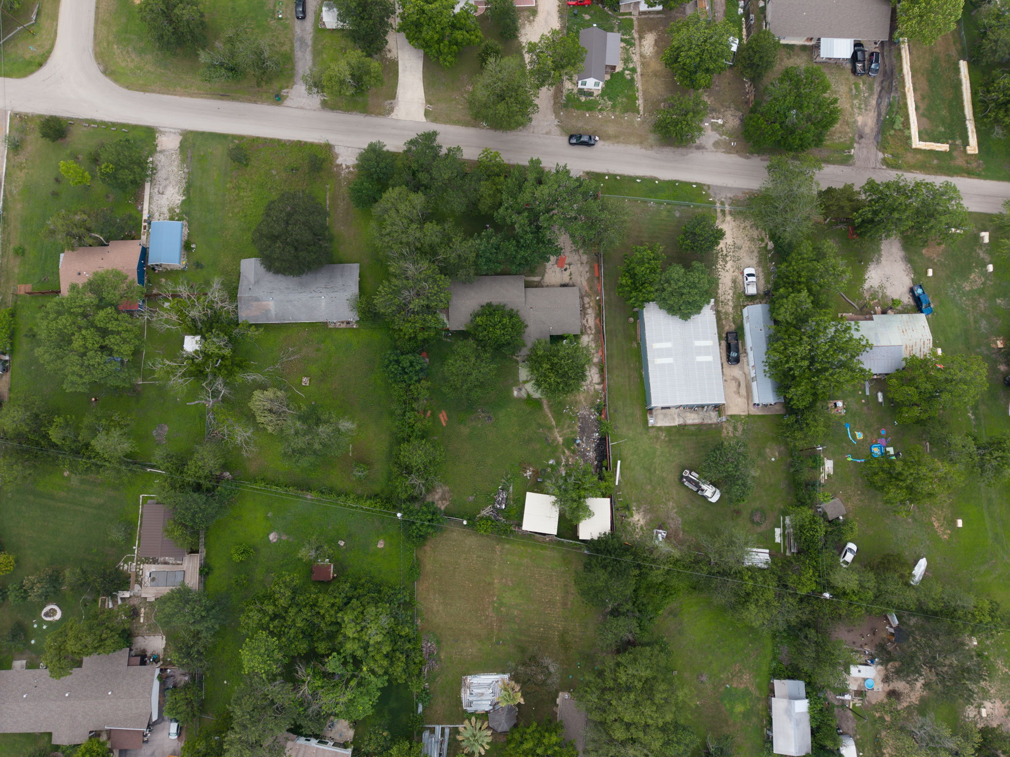 6803 Viewing Place Austin, TX 78719 - Photo 5 of 20 An aerial perspective reveals a verdant landscape with homes nestled amongst mature trees, showcasing spacious plots.