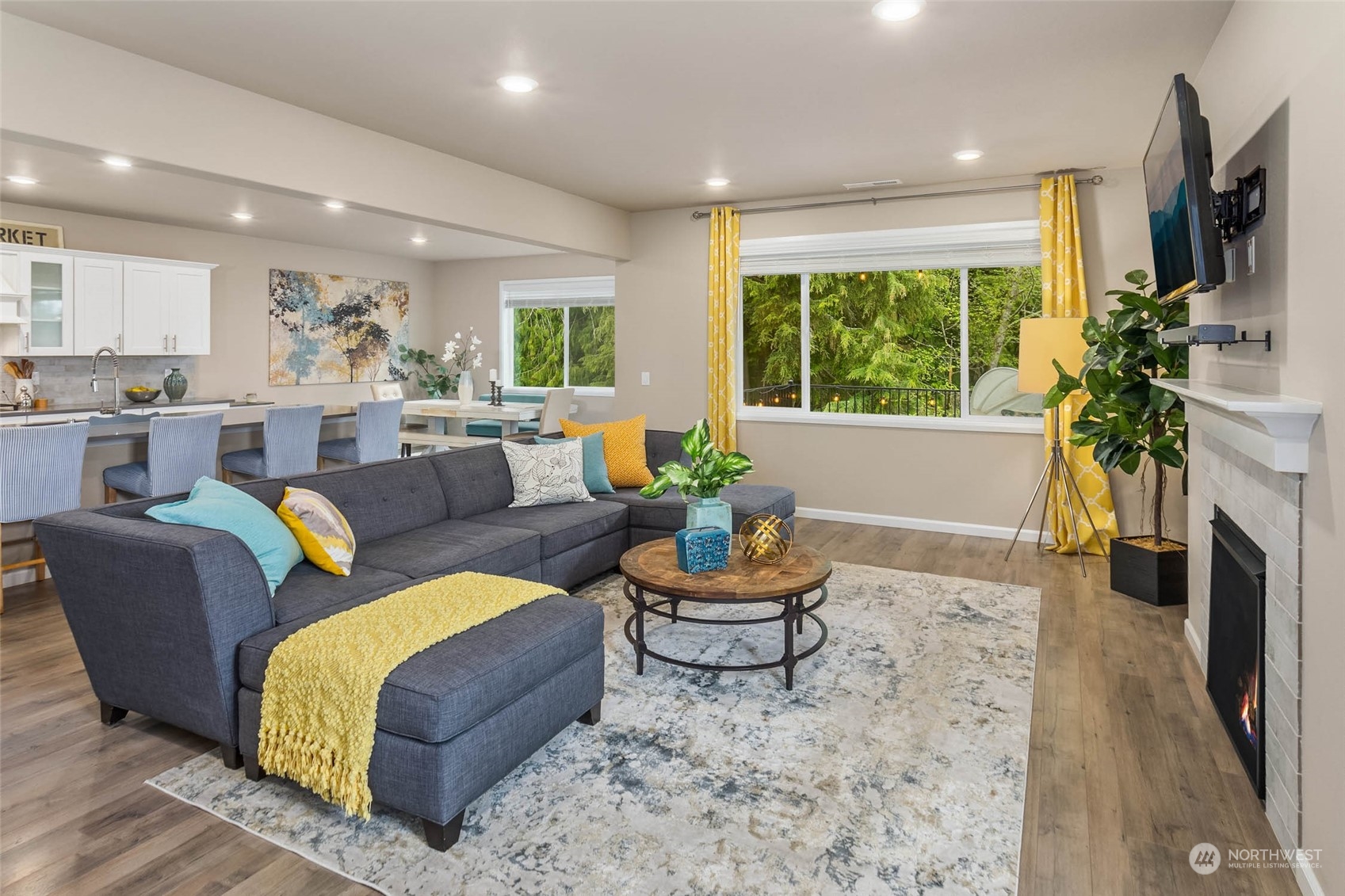 217 178th Street Southeast Bothell, WA 98012 - Photo 11 of 37 a living room with fireplace furniture and a large window