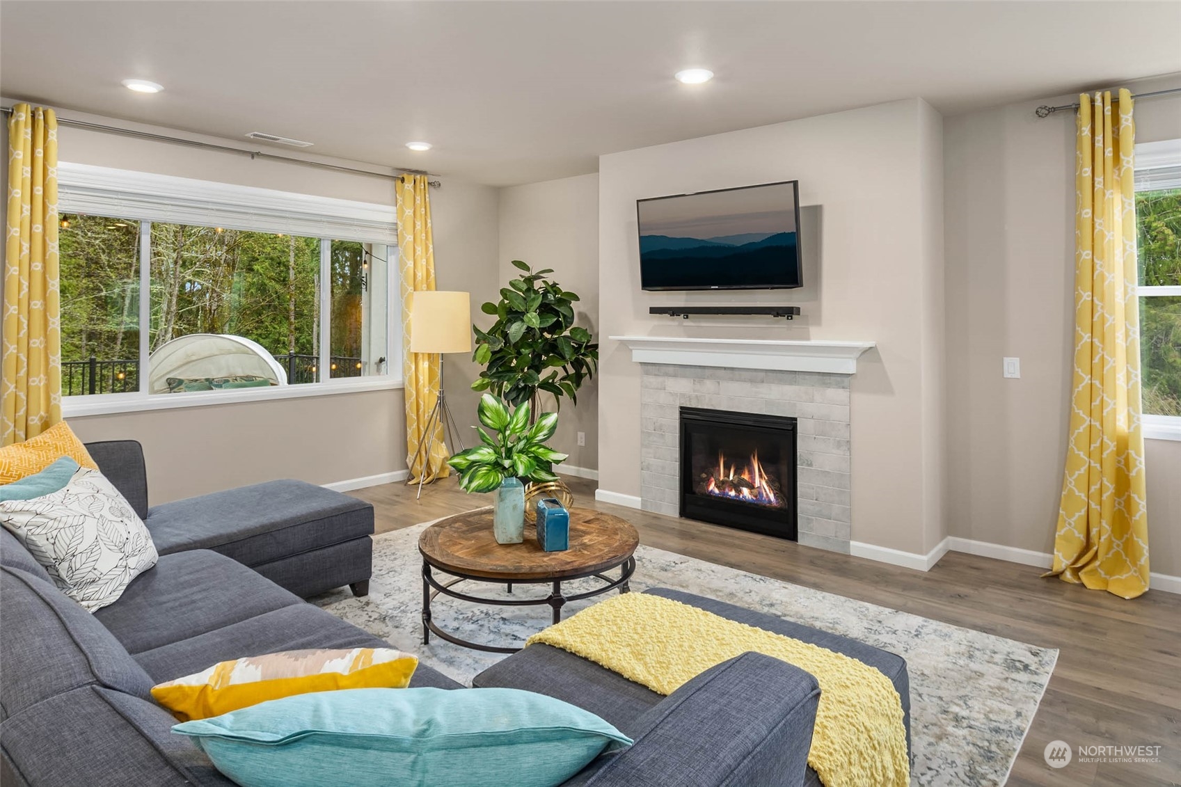 217 178th Street Southeast Bothell, WA 98012 - Photo 12 of 37 a living room with furniture fireplace and a large window