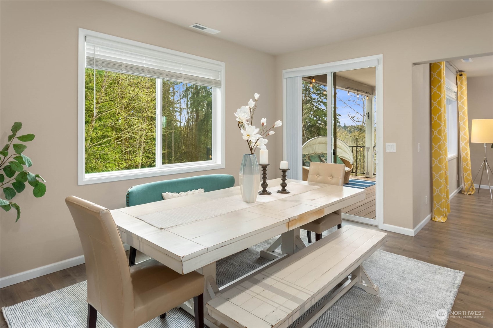 217 178th Street Southeast Bothell, WA 98012 - Photo 14 of 37 a view of a dining room with furniture window and wooden floor