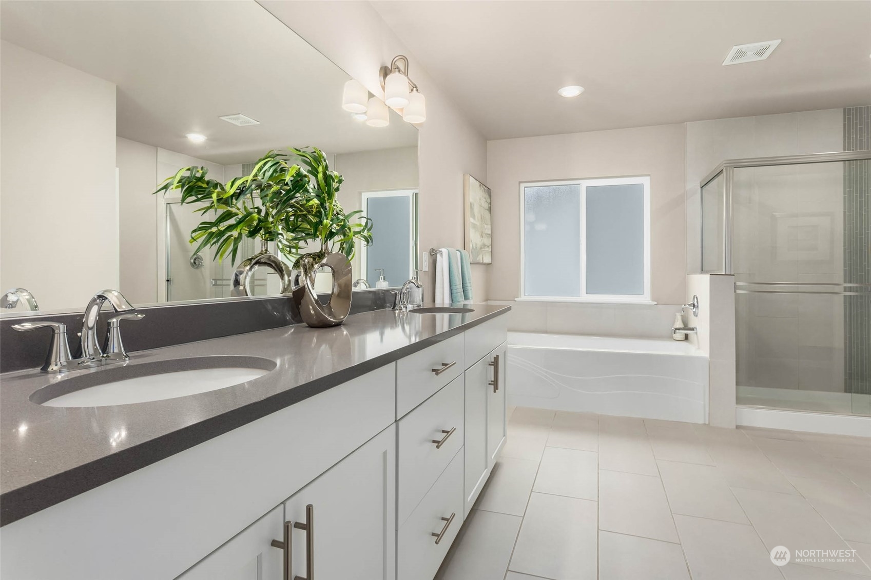 217 178th Street Southeast Bothell, WA 98012 - Photo 20 of 37 a bathroom with a double vanity sink and a bathtub
