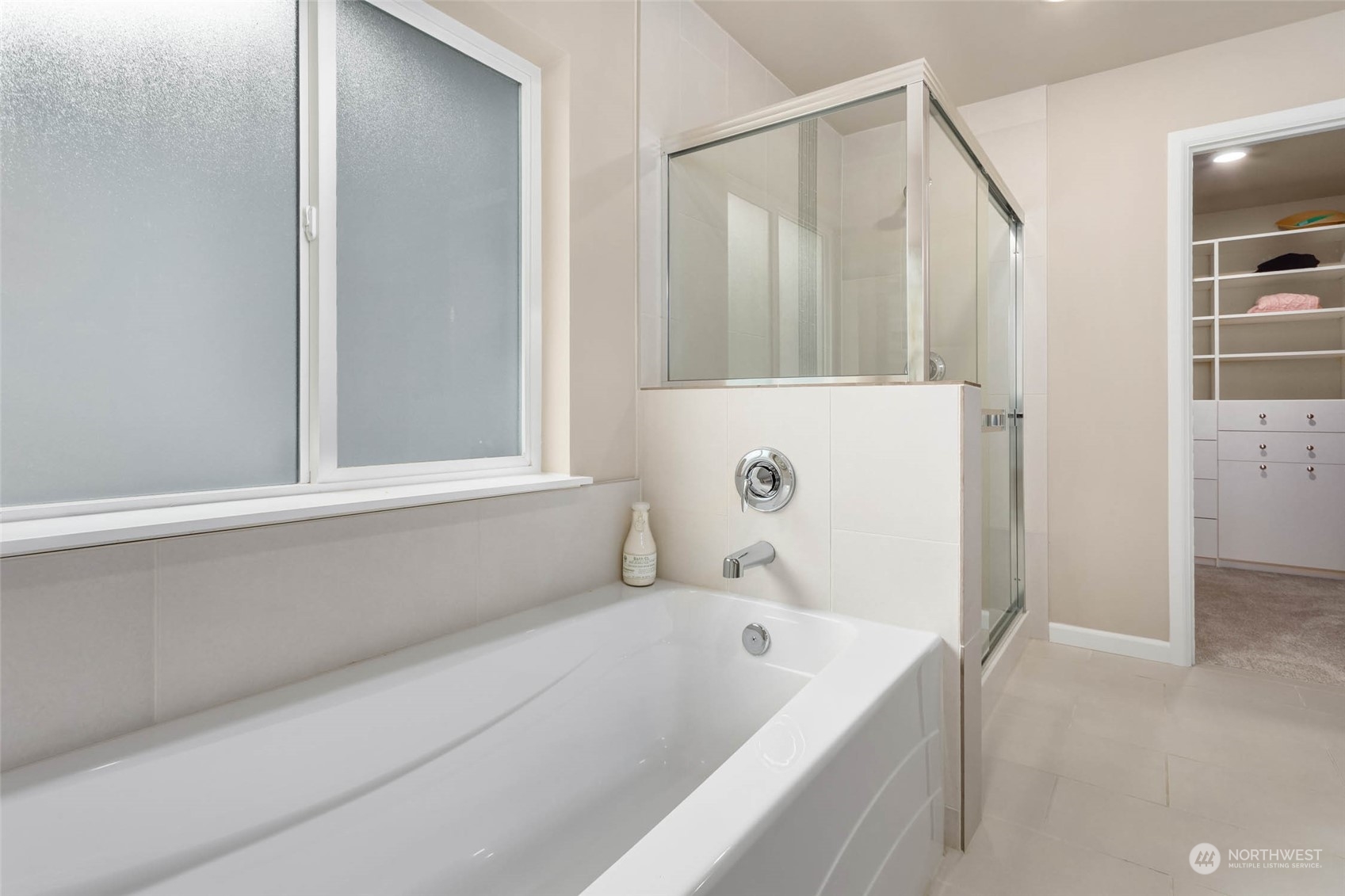 217 178th Street Southeast Bothell, WA 98012 - Photo 21 of 37 a bathroom with a tub and shower