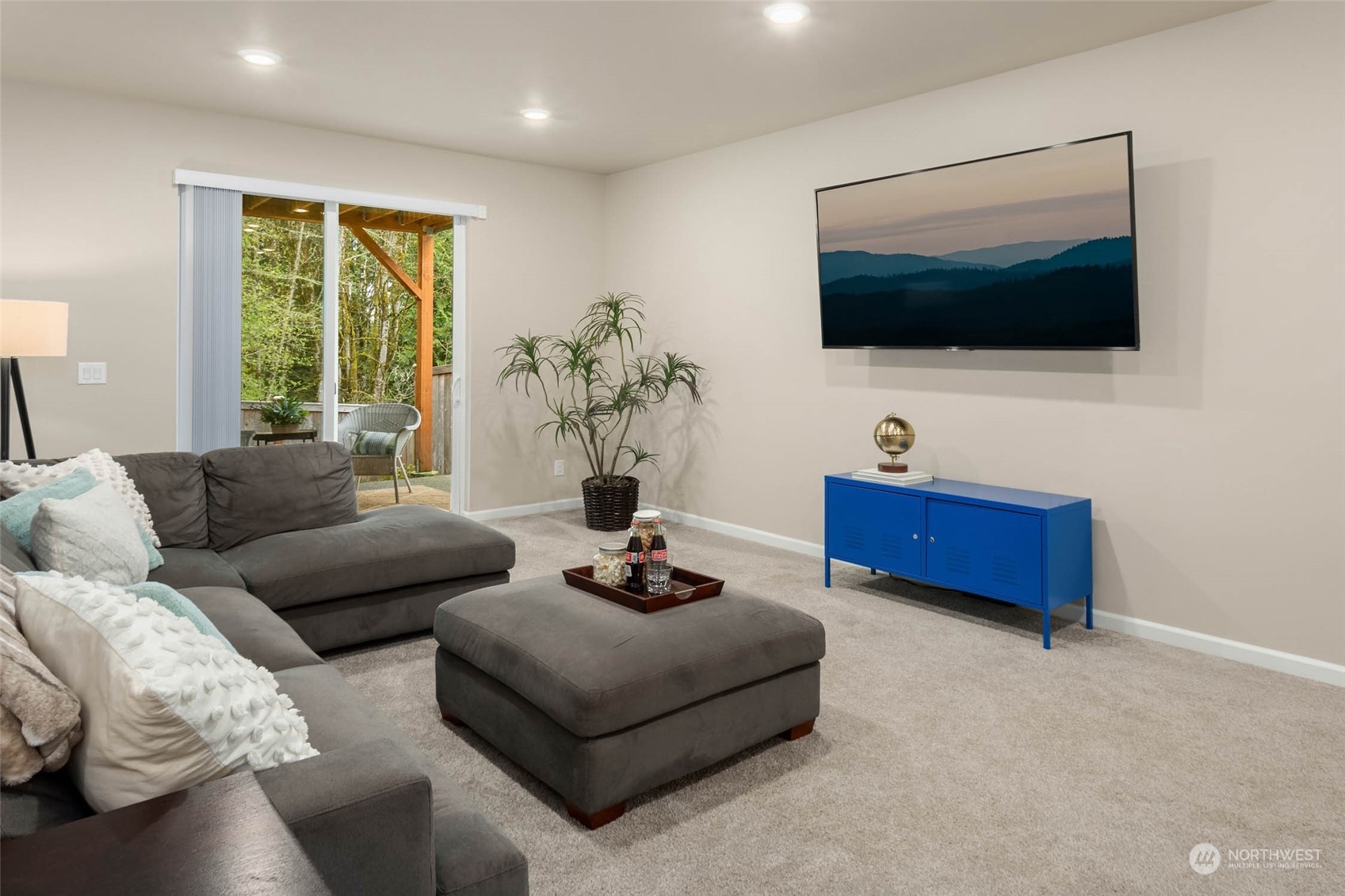 217 178th Street Southeast Bothell, WA 98012 - Photo 31 of 37 a living room with furniture and a flat screen tv