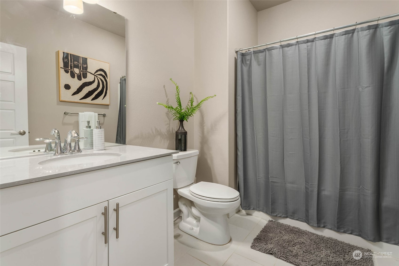 217 178th Street Southeast Bothell, WA 98012 - Photo 33 of 37 a bathroom with a granite countertop sink a toilet and a mirror