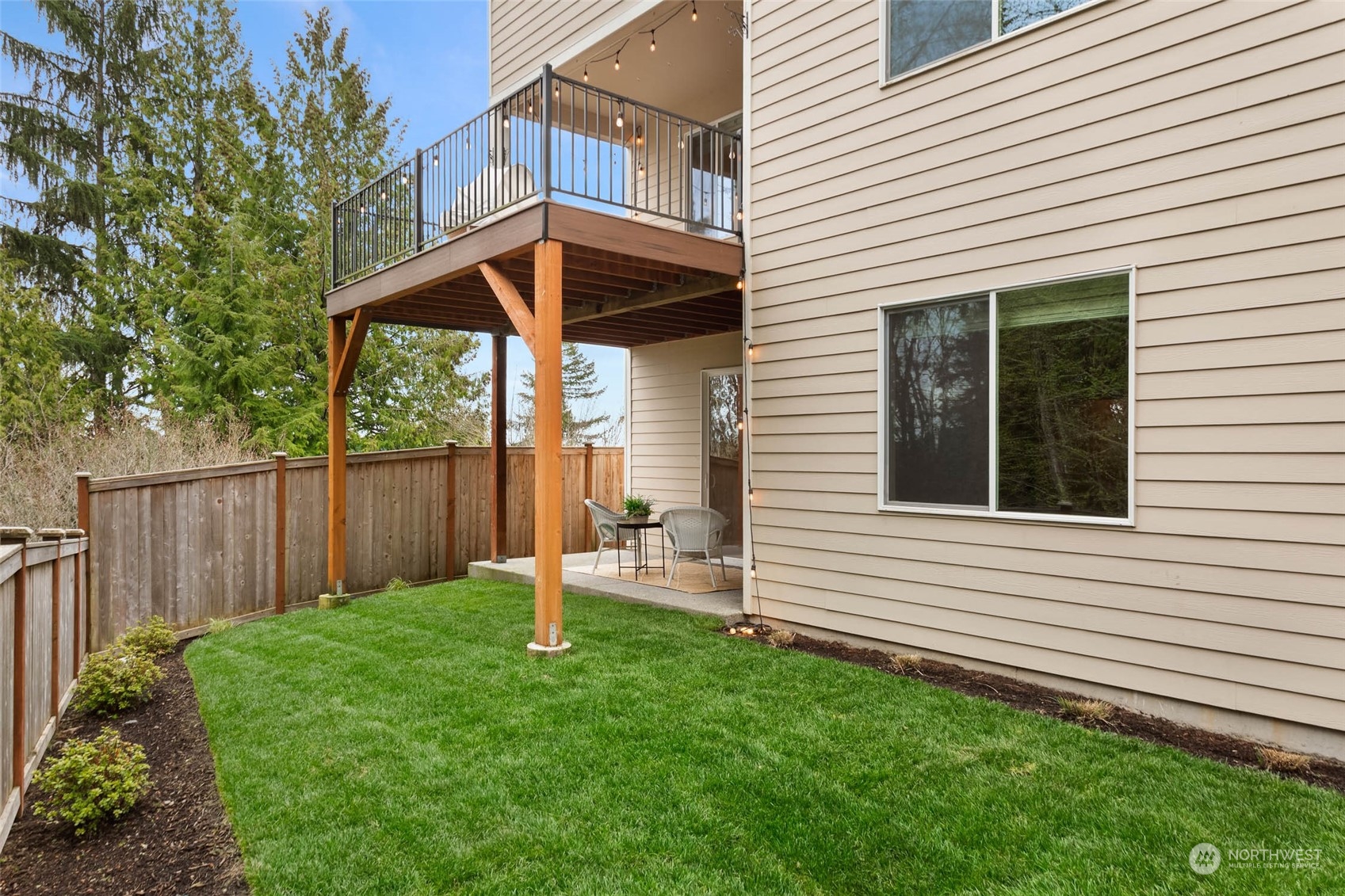 217 178th Street Southeast Bothell, WA 98012 - Photo 35 of 37 a view of backyard with small cabin and wooden fencing