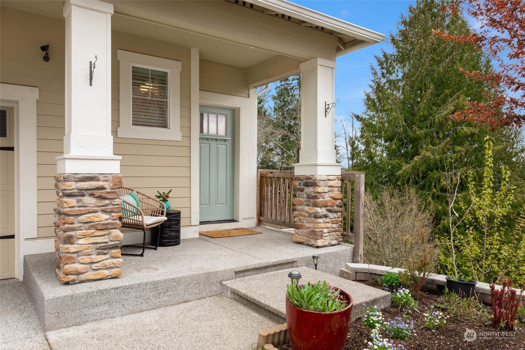 217 178th Street Southeast Bothell, WA 98012 - Photo 4 of 37 a view of a patio with couches table and chairs and potted plants
