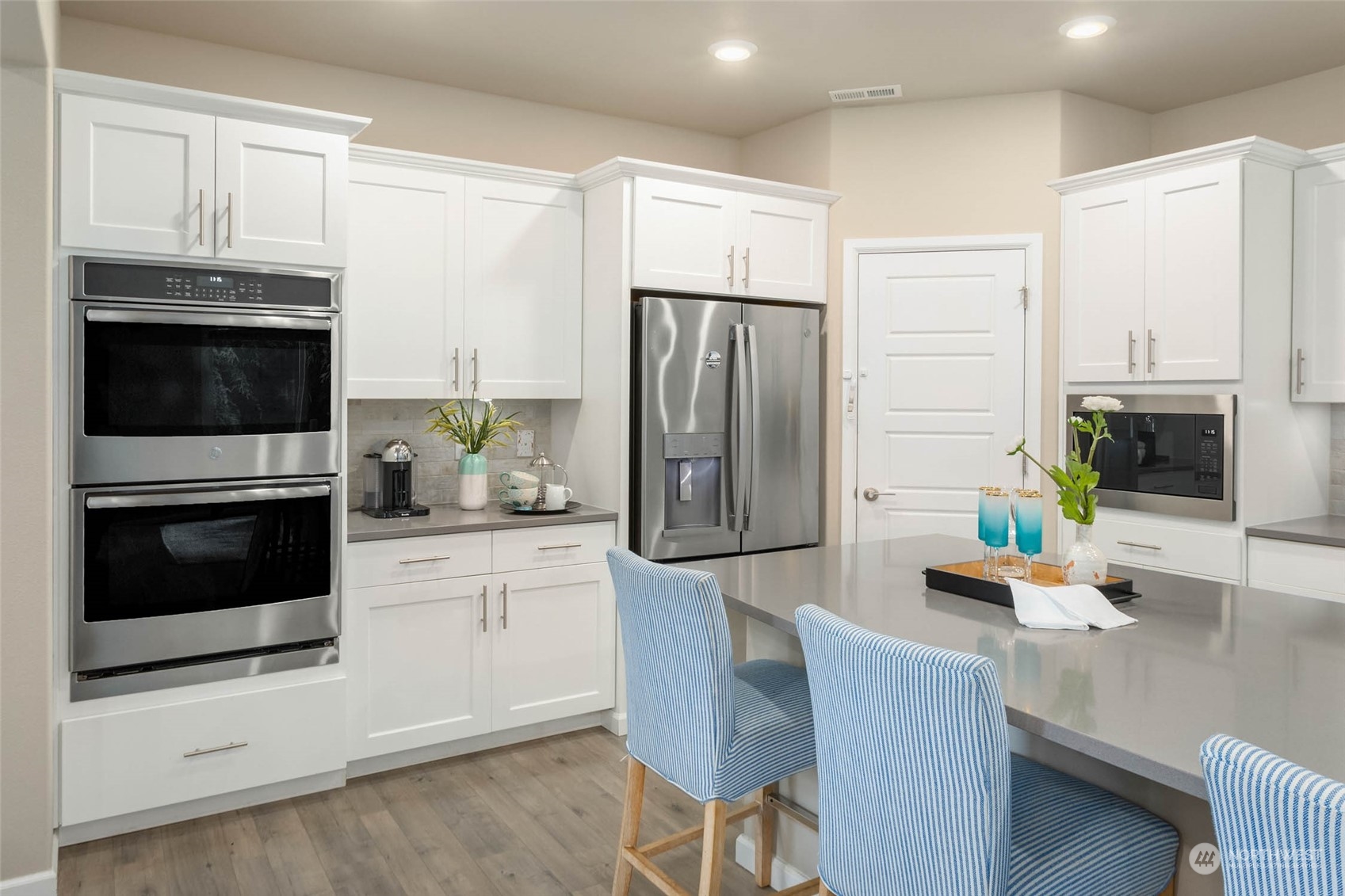 217 178th Street Southeast Bothell, WA 98012 - Photo 9 of 37 a kitchen with stainless steel appliances a refrigerator stove microwave and cabinets