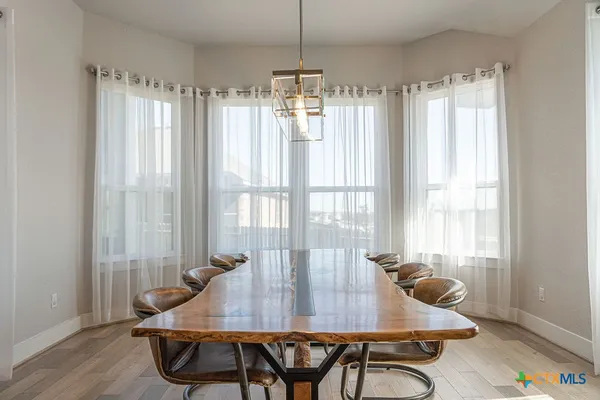 a view of a room with furniture and window